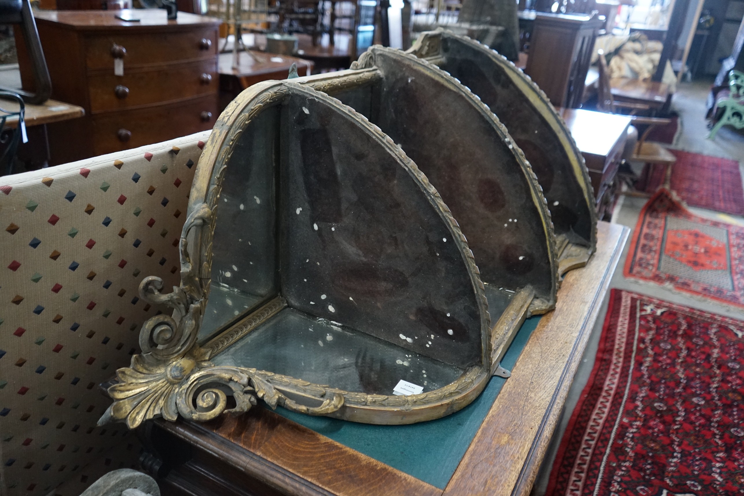 A Victorian giltwood and gesso mirrored corner wall bracket, width 74cm, depth 45cm, height 140cm